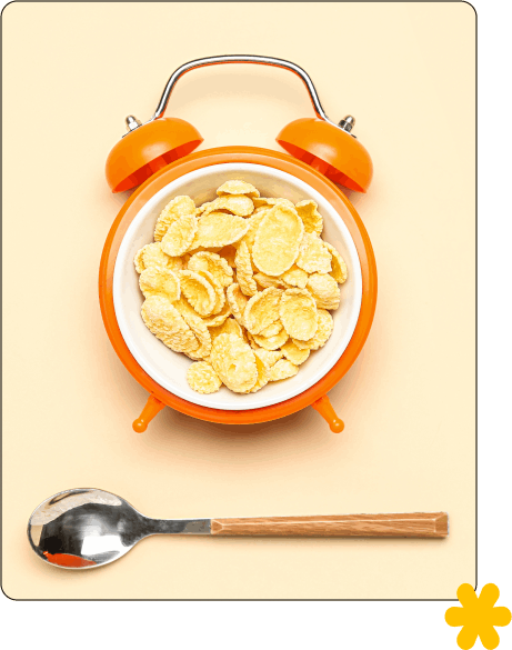 צלחת בצורת שעון מעורר עם קורנפלקס